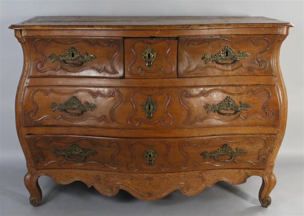 Appraisal: CONTINENTAL PROVINCIAL CARVED FRUITWOOD BOMBAY COMMODE having a rectangular top