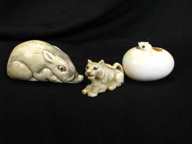 Appraisal: Three Japanese Carved Netsuke including '' warthog a chick in