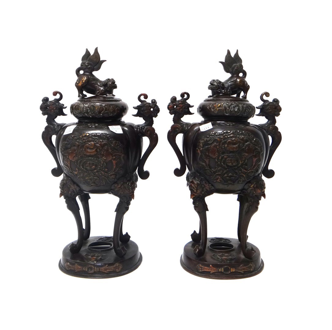 Appraisal: A pair of Japanese bronze two-handled koros and covers Meiji