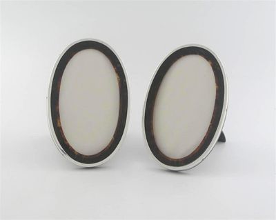 Appraisal: A pair of modern oval photograph frames with tortoiseshell mounts