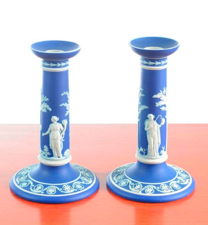 Appraisal: PAIR OF WEDGWOOD JASPERWARE CANDLESTICKS with classical white figures on