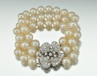 Appraisal: A Diamond k Gold and Pearl Bracelet Three strands of