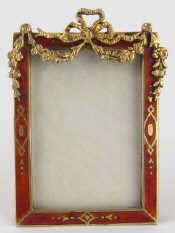 Appraisal: A silver and red enamel photo frame Vienna import marks