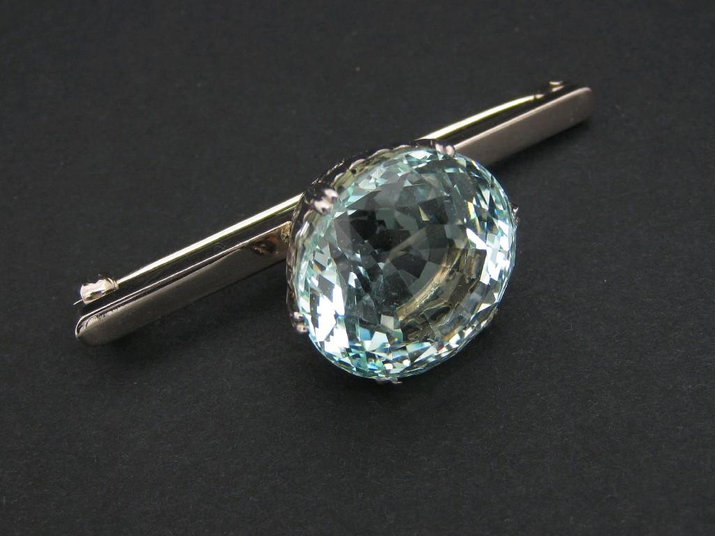 Appraisal: An Aquamarine single stone Bar Brooch claw-set large mixed-cut stone