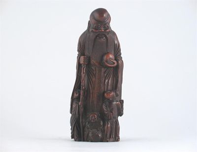 Appraisal: A Chinese bamboo carving of Shoulao standing holding a peach