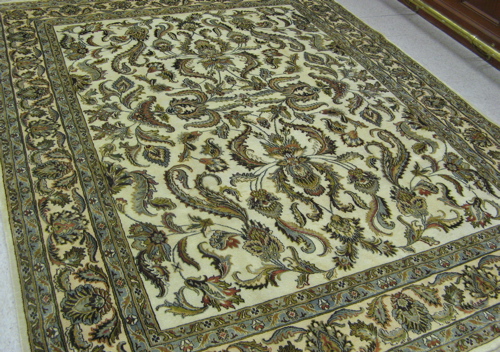 Appraisal: HAND KNOTTED ORIENTAL CARPET Persian floral design on cream ground