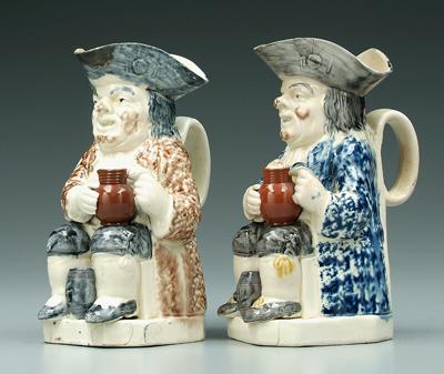 Appraisal: Two similar Toby jugs both with keg between their knees