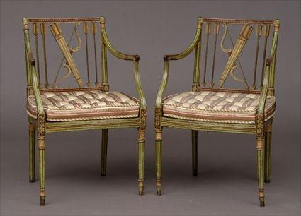 Appraisal: PAIR OF GEORGE III GREEN-PAINTED ARMCHAIRS Each curved pearlwork top