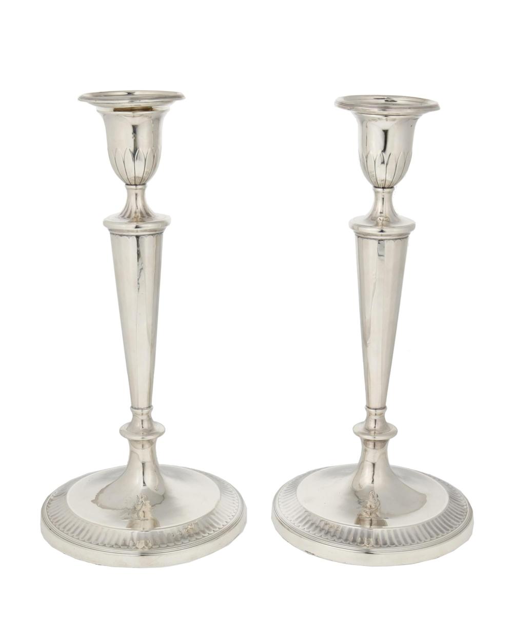 Appraisal: A pair of Georgian English sterling silver candlesticks Each marked