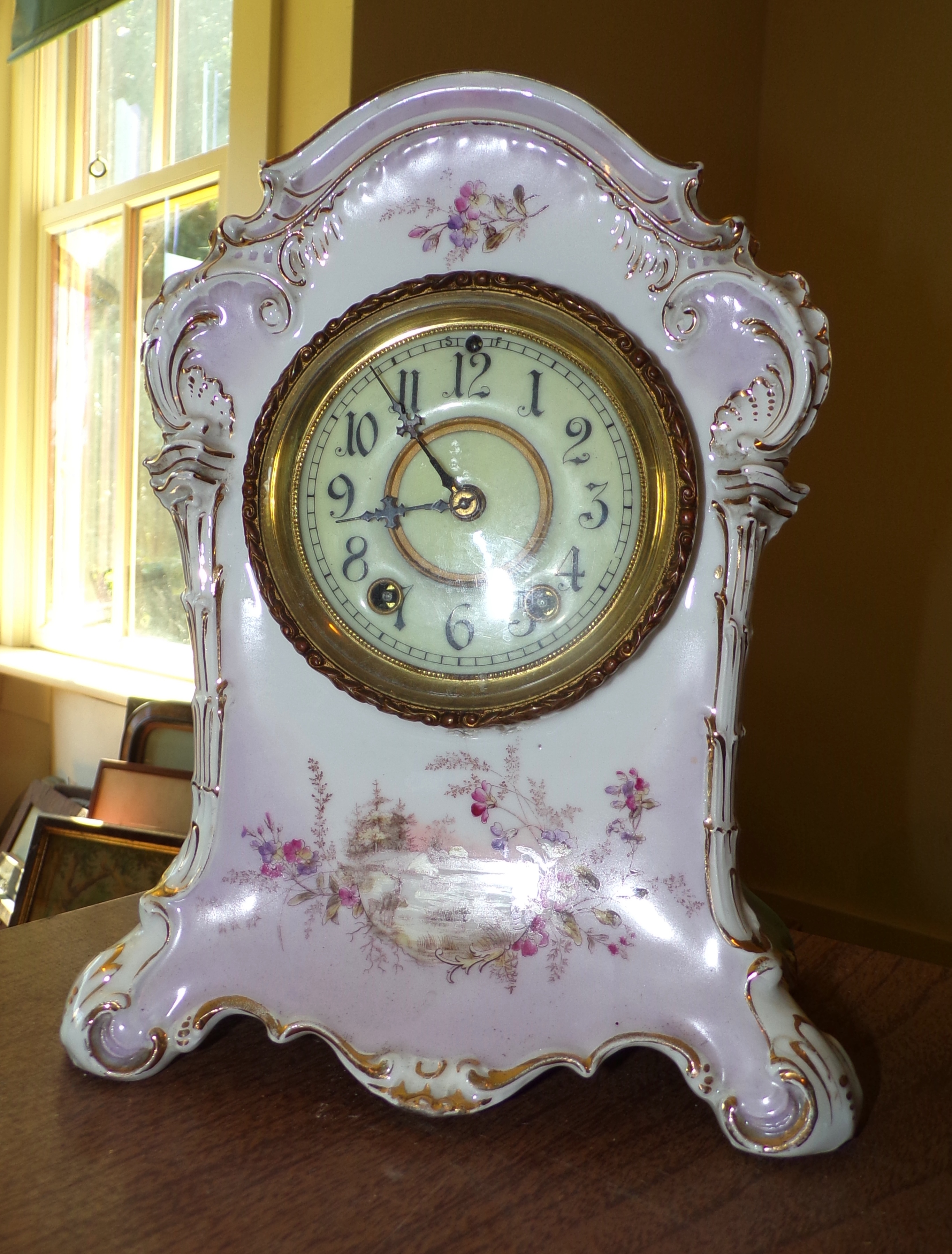 Appraisal: Waterbury china cased clock -day time and strike ''