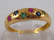 Appraisal: A yellow metal tests carat gold emerald ruby and sapphire