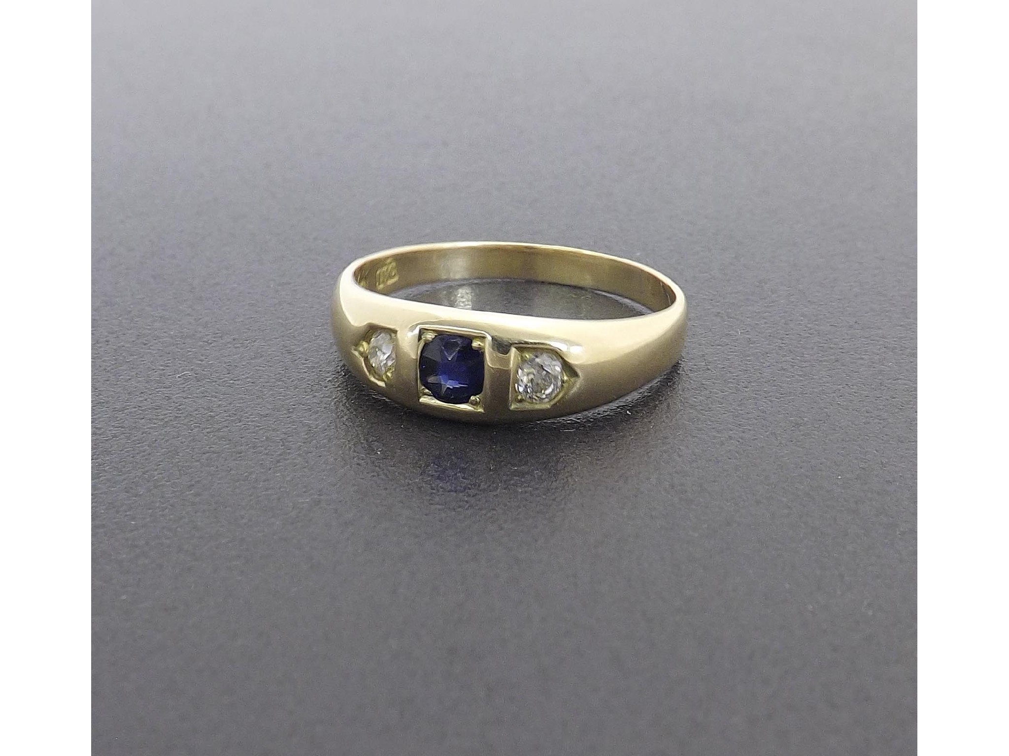 Appraisal: ct three stone diamond and sapphire set ring gm ring