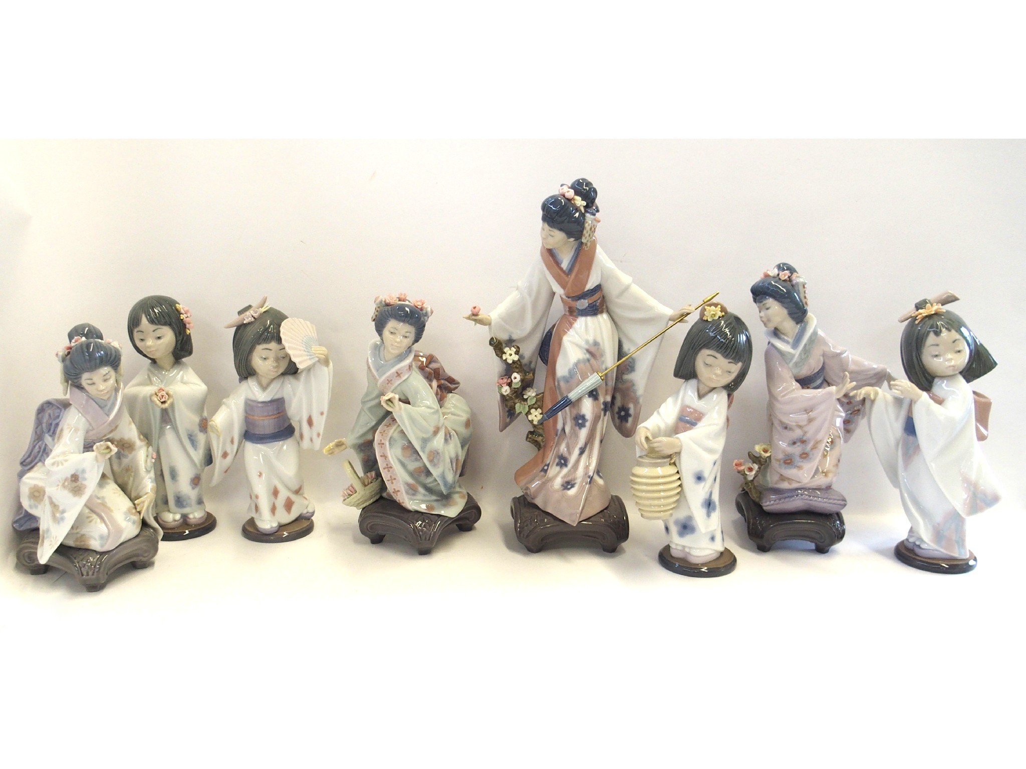 Appraisal: Four Lladro figures of Geishas and four others of girls