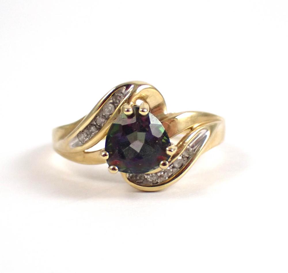 Appraisal: MYSTIC TOPAZ DIAMOND AND YELLOW GOLD RING The k gold