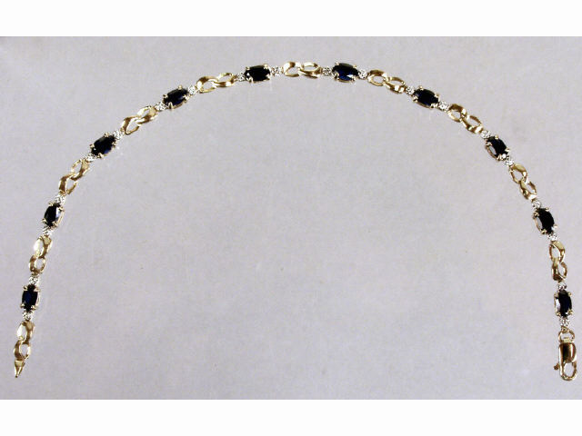 Appraisal: Ladies karat yellow gold created sapphire and diamond bracelet Retail