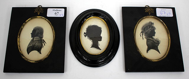 Appraisal: A PAIR OF SILHOUETTES OF A GENTLEMAN AND A LADY