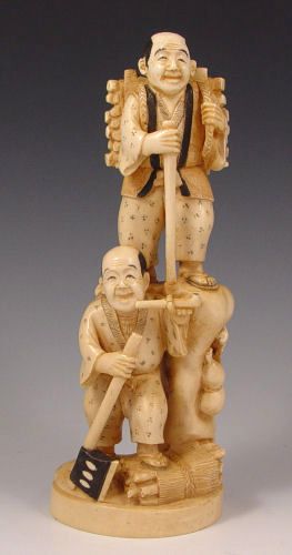 Appraisal: JAPANESE CARVED IVORY FIGURE OF TWO WOOD SELLERS Carved from