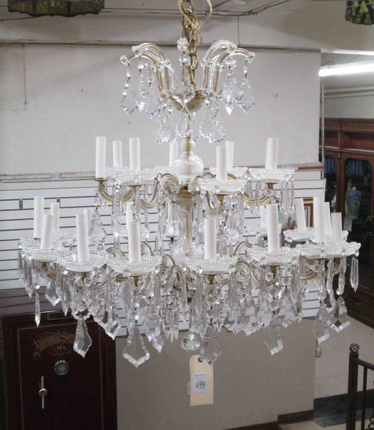 Appraisal: LOUIS XV STYLE CRYSTAL CHANDELIER the candlestick arms arranged in