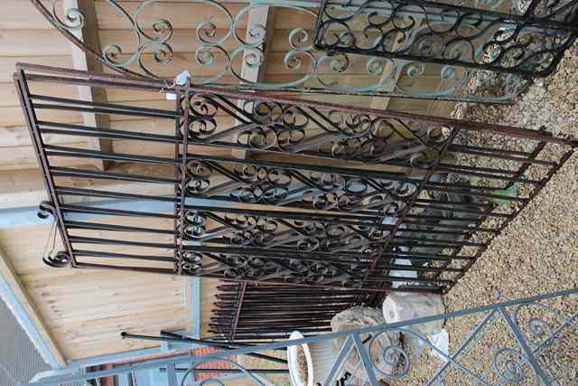 Appraisal: A PAIR OF WROUGHT IRON ENTRANCE GATES formerly black painted