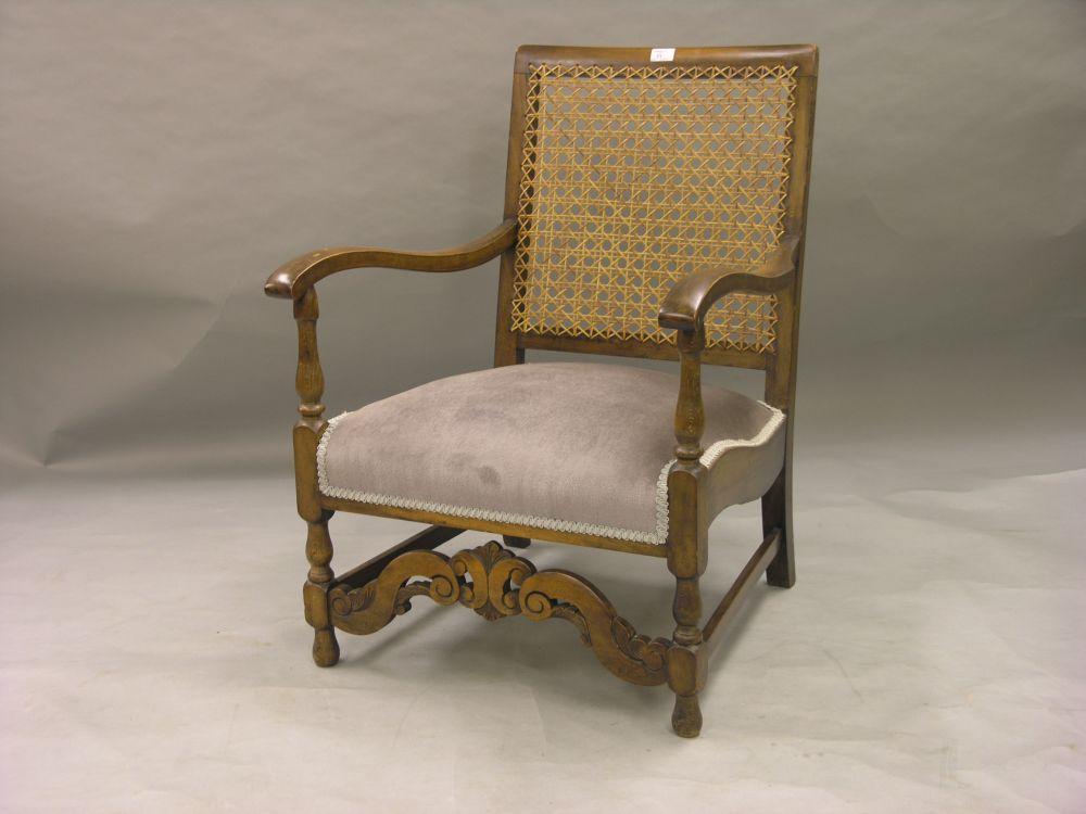 Appraisal: An early th century nursing armchair caned back dralon seat