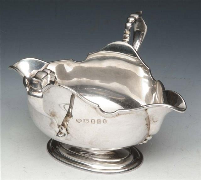 Appraisal: A SILVER TWO HANDLED SAUCE BOAT with two spouts shaped