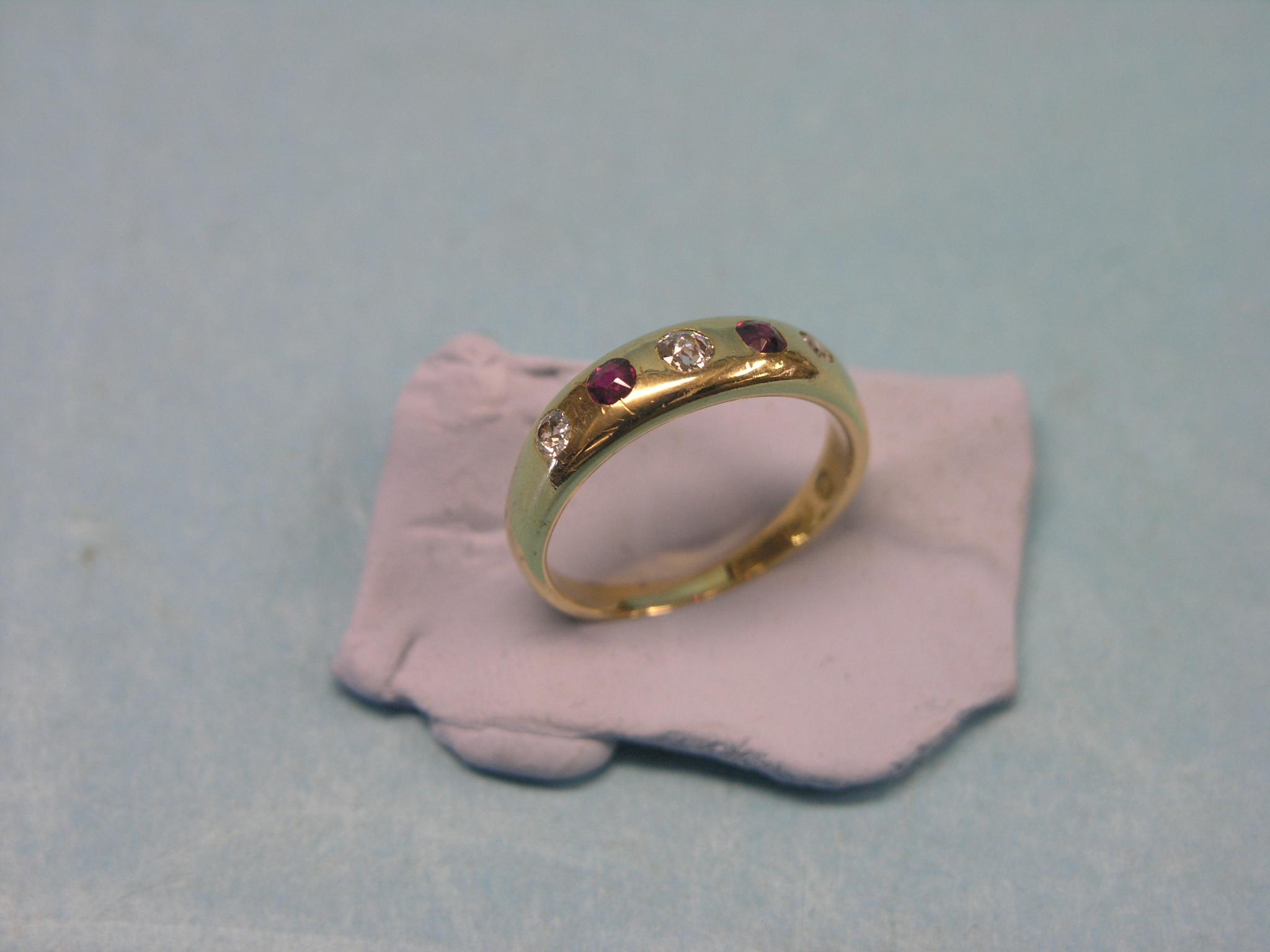 Appraisal: An ct gold diamond and ruby ring three small diamonds