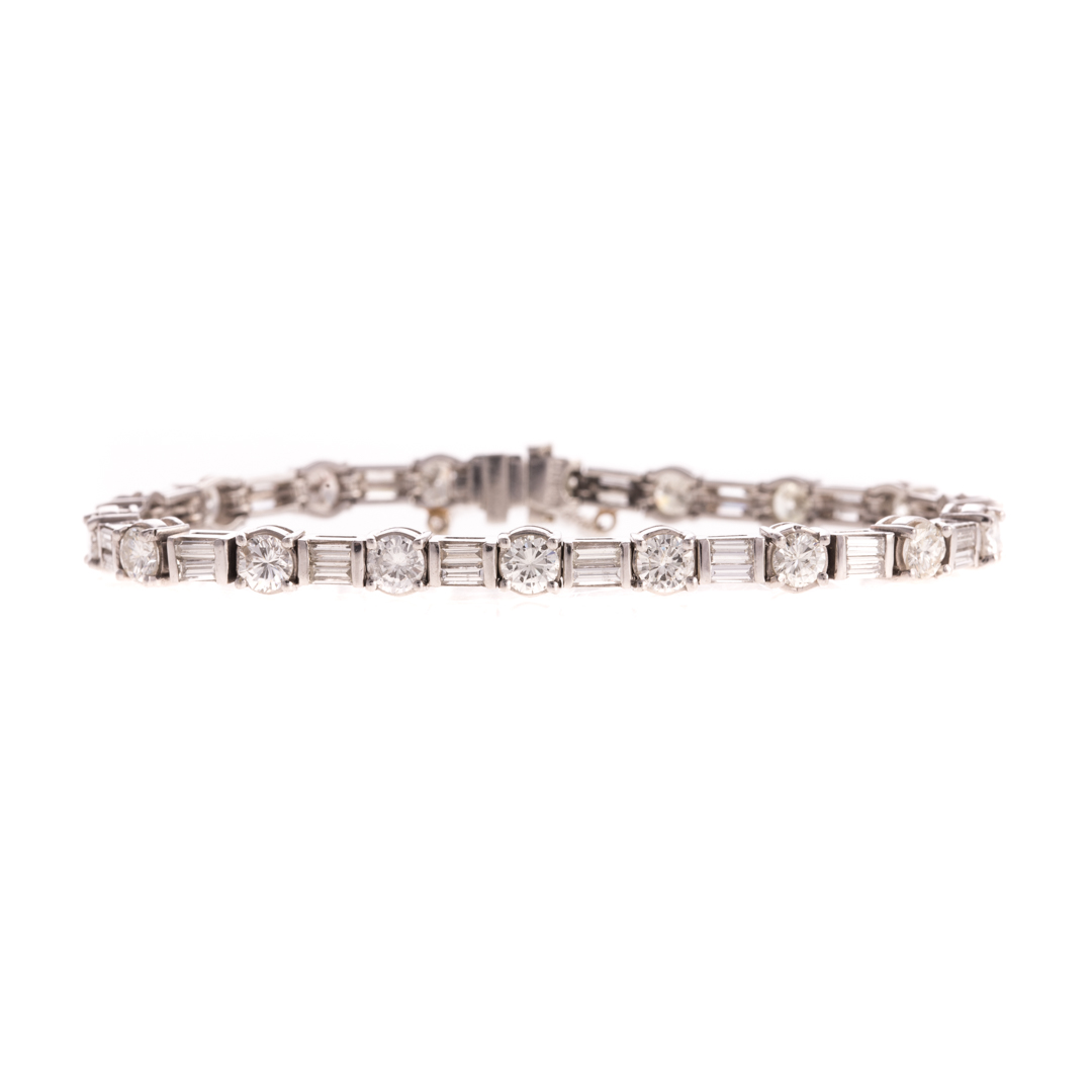 Appraisal: An Alternating Round Baguette Diamond Bracelet Platinum straight line bracelet