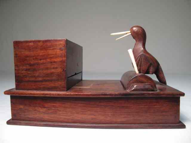 Appraisal: A carved rosewood novelty box with carved ivory details Bird