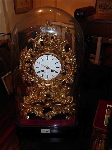 Appraisal: A GILT SPELTER FRENCH ROCOCO CLOCK with enamelled dial signed