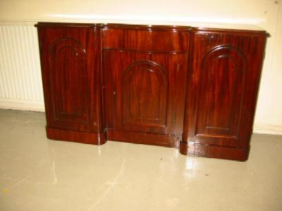 Appraisal: A MID VICTORIAN MAHOGANY CHIFFONIER of inverted breakfront form with