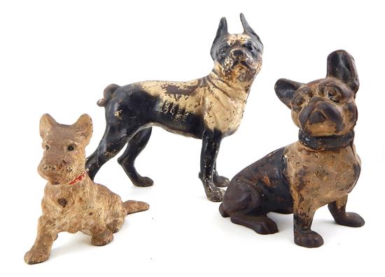 Appraisal: Three painted cast-metal dog doorstops standing black and white Boston