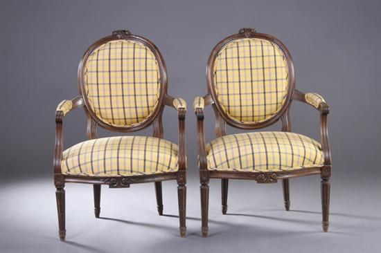 Appraisal: PAIR LOUIS XVI STYLE FRUITWOOD FAUTEUILS th century with yellow