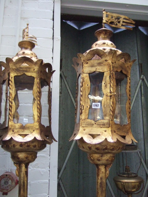 Appraisal: A pair of Venetian gilt and tin gondola lanterns late