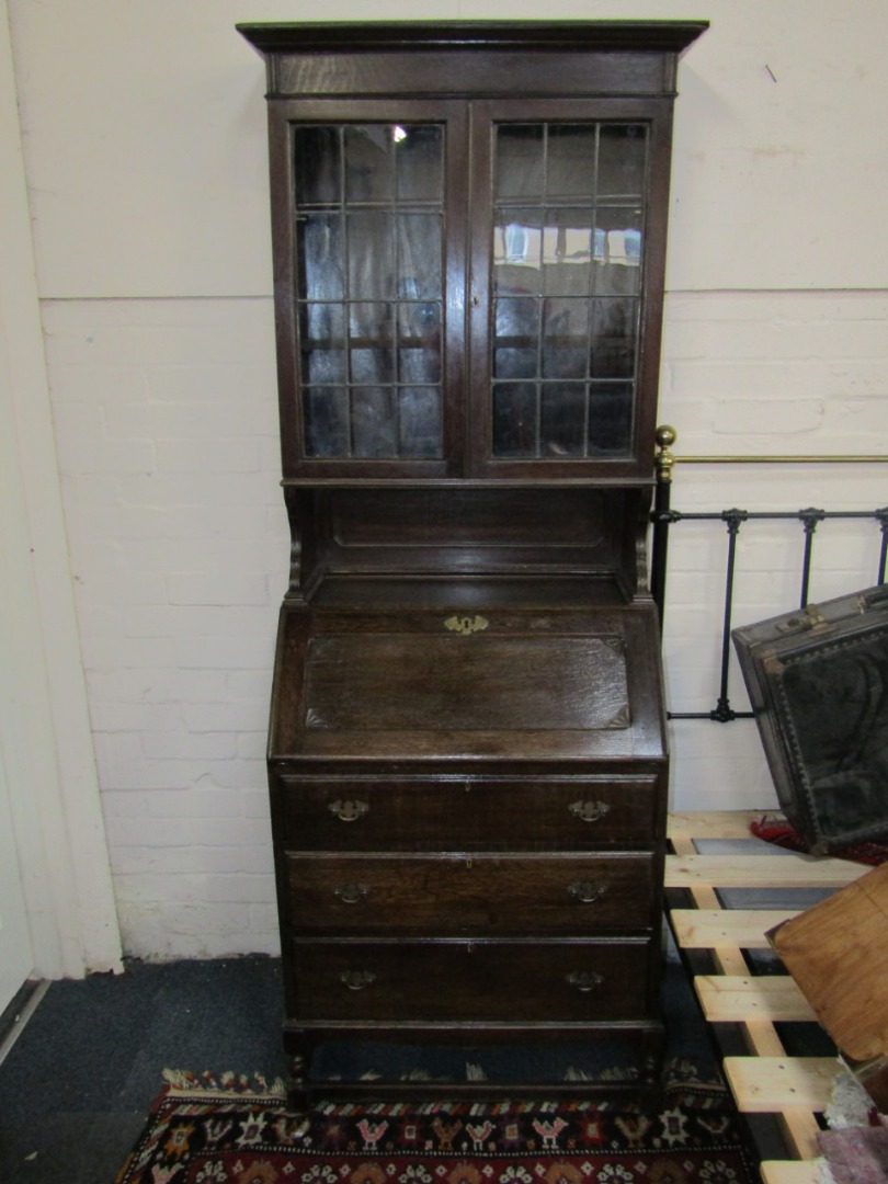 Appraisal: A 's oak bureau bookcase the top with moulded cornice