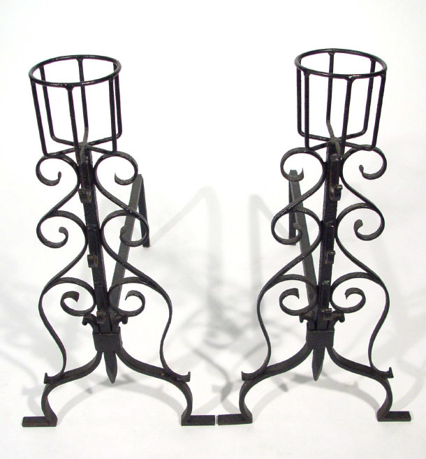 Appraisal: Pair of wrought iron fire dogs with basket design mounts