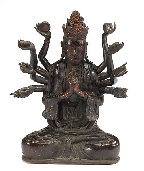 Appraisal: A lacquered wood figure of Guanyin th Century Seated in