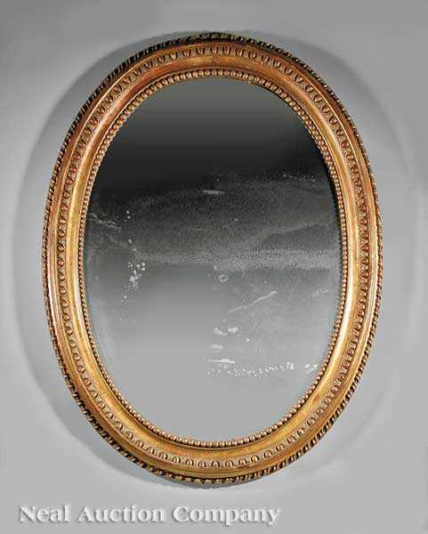 Appraisal: A Monumental Louis Philippe Carved and Gilded Oval Mirror mid-