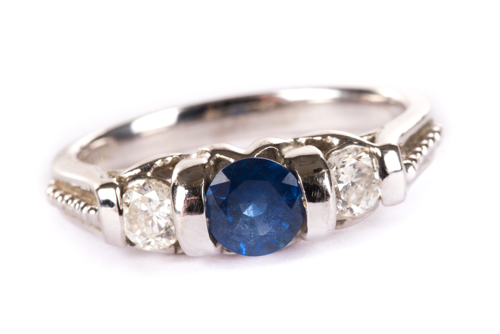 Appraisal: A Sapphire and Diamond Band in White Gold center round