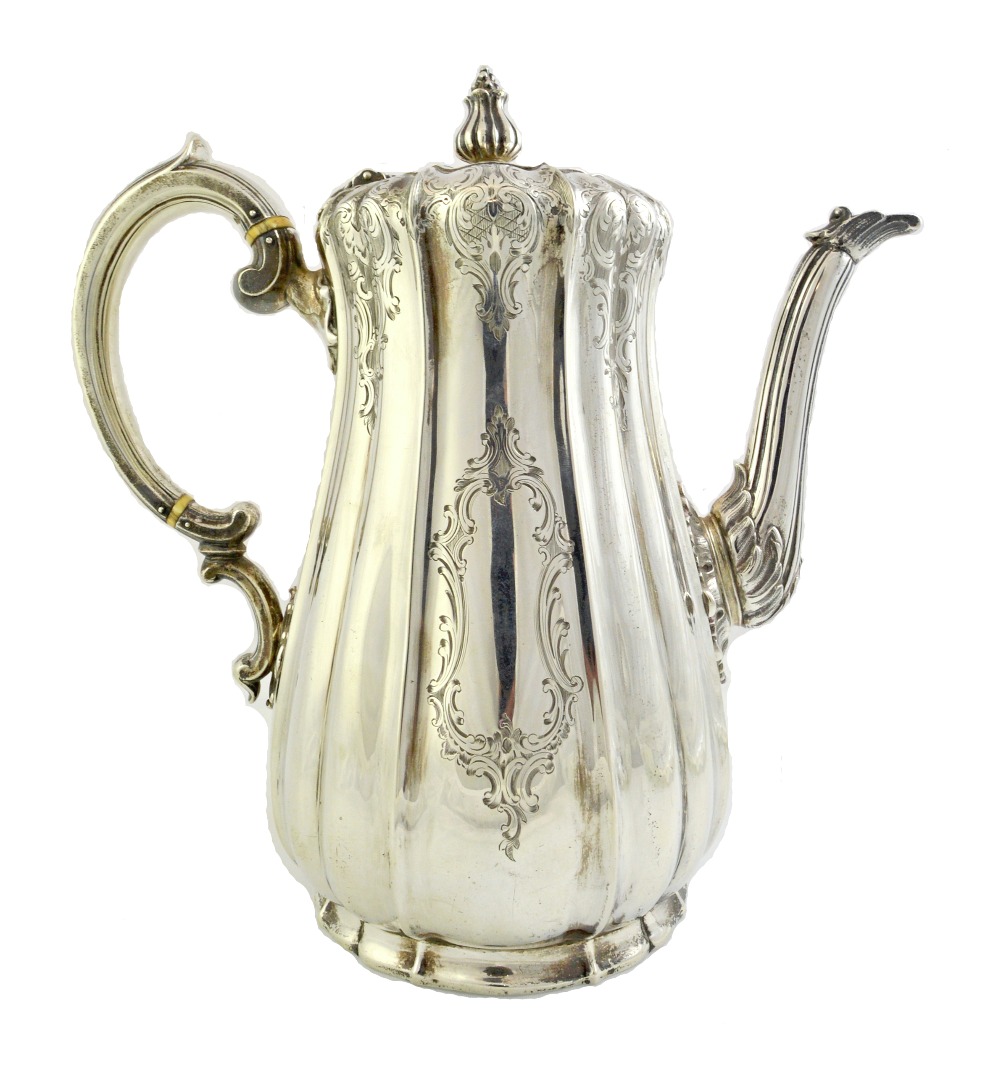 Appraisal: A Victorian silver coffee pot of baluster form with a