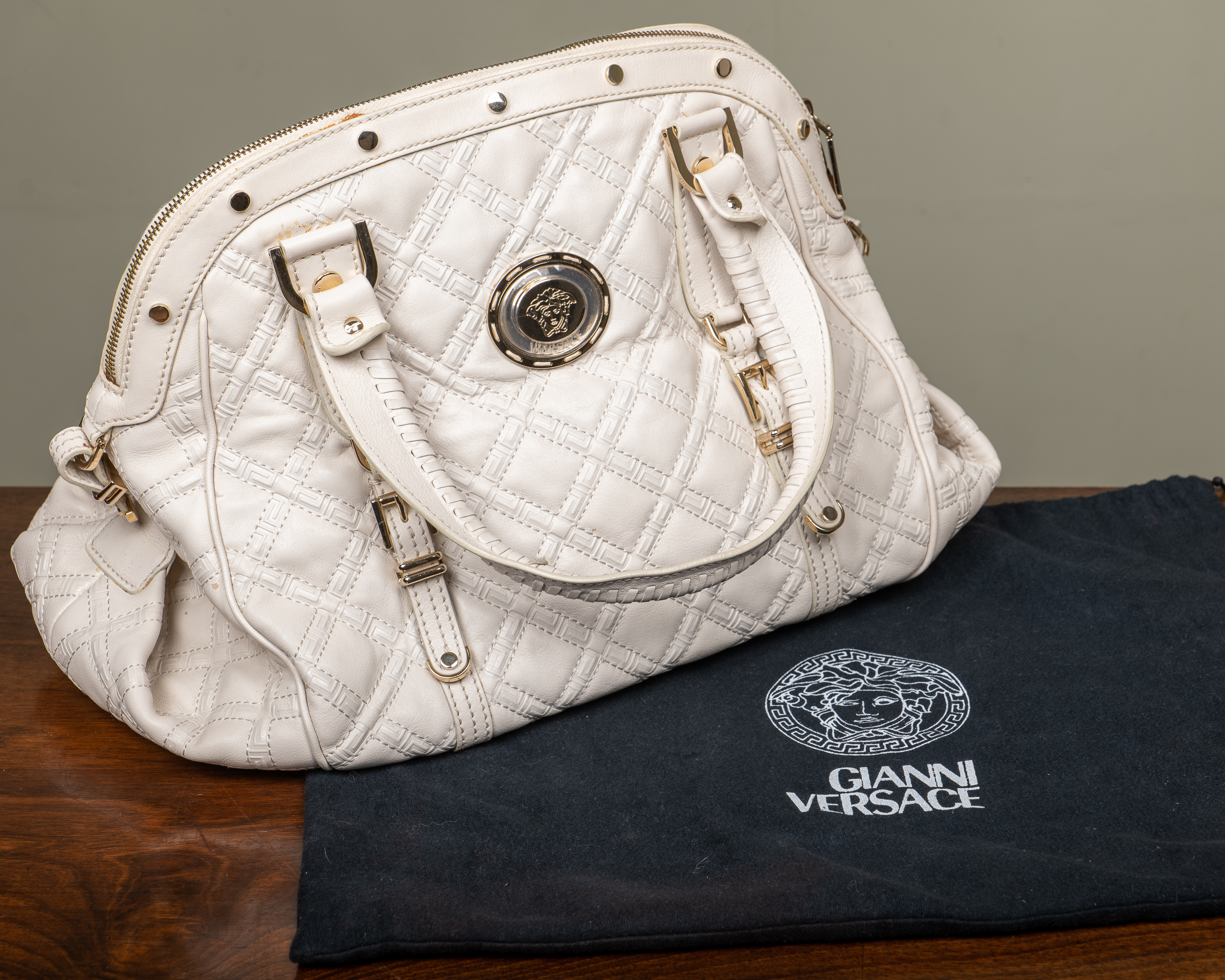 Appraisal: A vintage ladies Versace white leather handbag with cross hatched