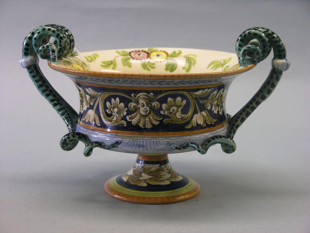 Appraisal: A th century Italian Majolica comport with coiled serpent handles