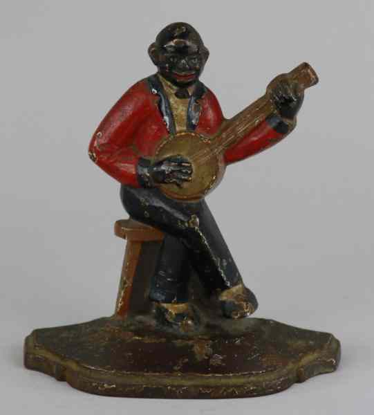 Appraisal: SPENCER BLACK MUSICIAN DOORSTOP Finely cast banjo player rare example