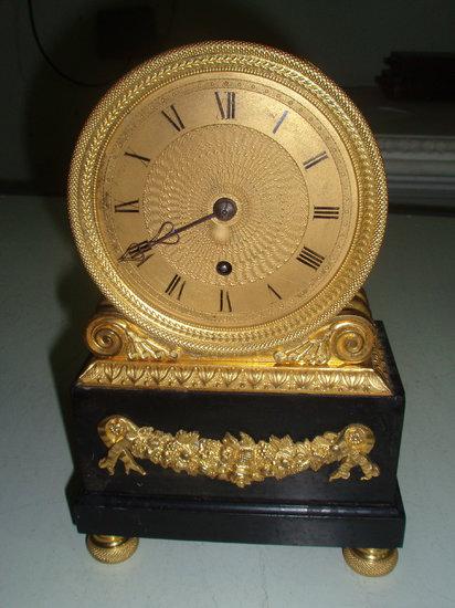 Appraisal: A Regency Ormolu and black stone mantel clock the drum