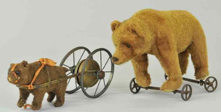 Appraisal: TWO TEDDY BEARS ON WHEELS c - both German Steiff