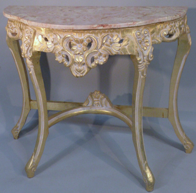 Appraisal: A thC Italian marbled and gilt wood console table the