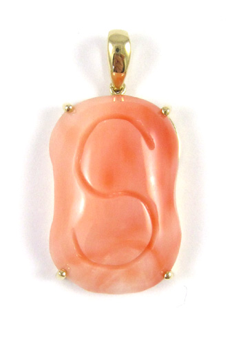 Appraisal: PINK CORAL AND FOURTEEN KARAT GOLD PENDANT the pink coral