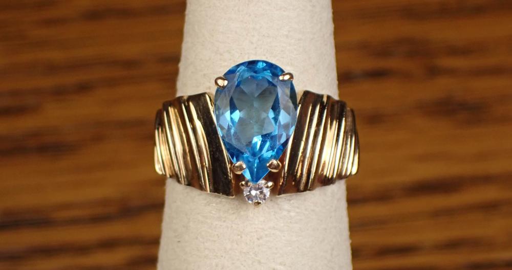 Appraisal: BLUE TOPAZ DIAMOND AND FOURTEEN KARAT GOLD RING The k