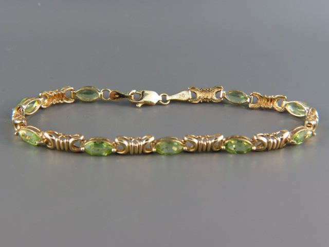 Appraisal: Peridot Bracelet nine marquise gems totaling over carats k yellow