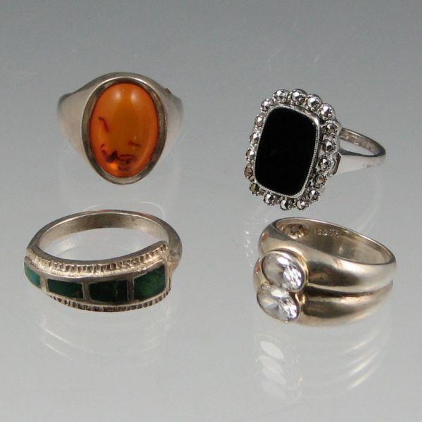 Appraisal: Four sterling silver rings including one with faux diamonds one