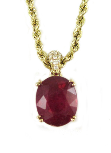 Appraisal: RUBY DIAMOND AND YELLOW GOLD PENDANT NECKLACE Suspended on a